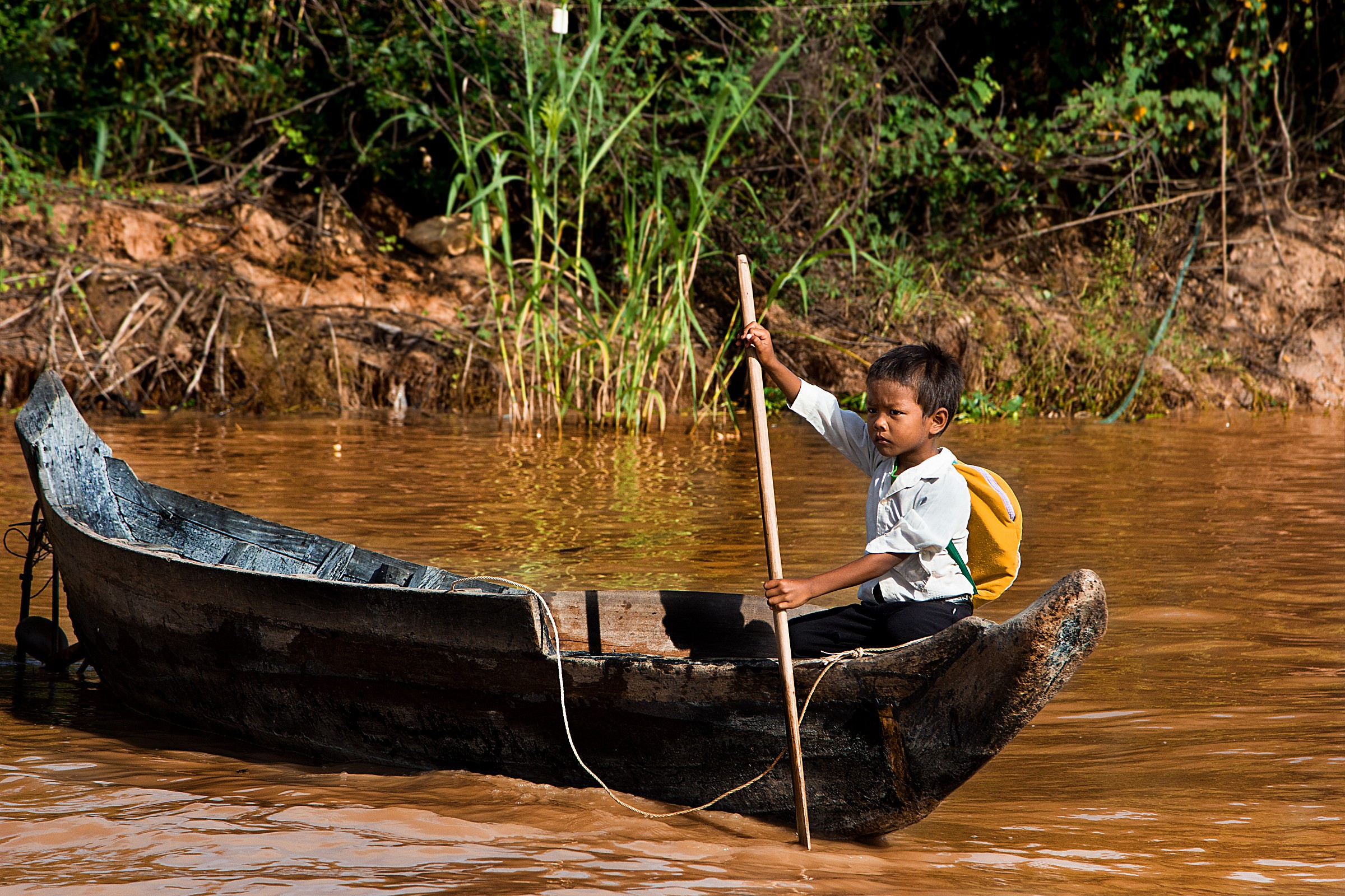 .. Not all children go to school by boat .. Cambodia....