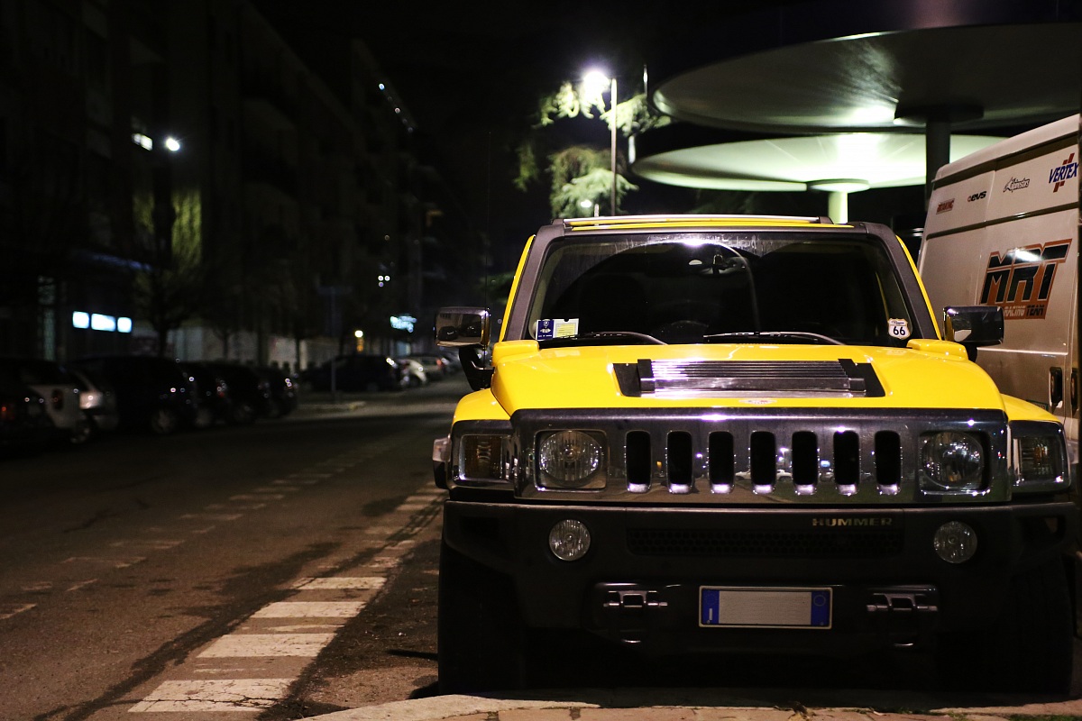 Yellow SUV stands out in the night...