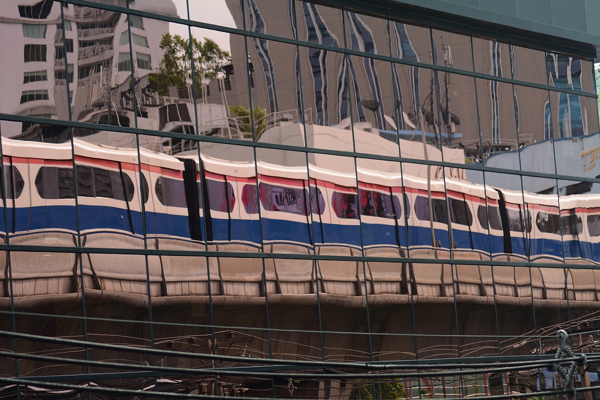 skytrain reflected in a skyscraper...