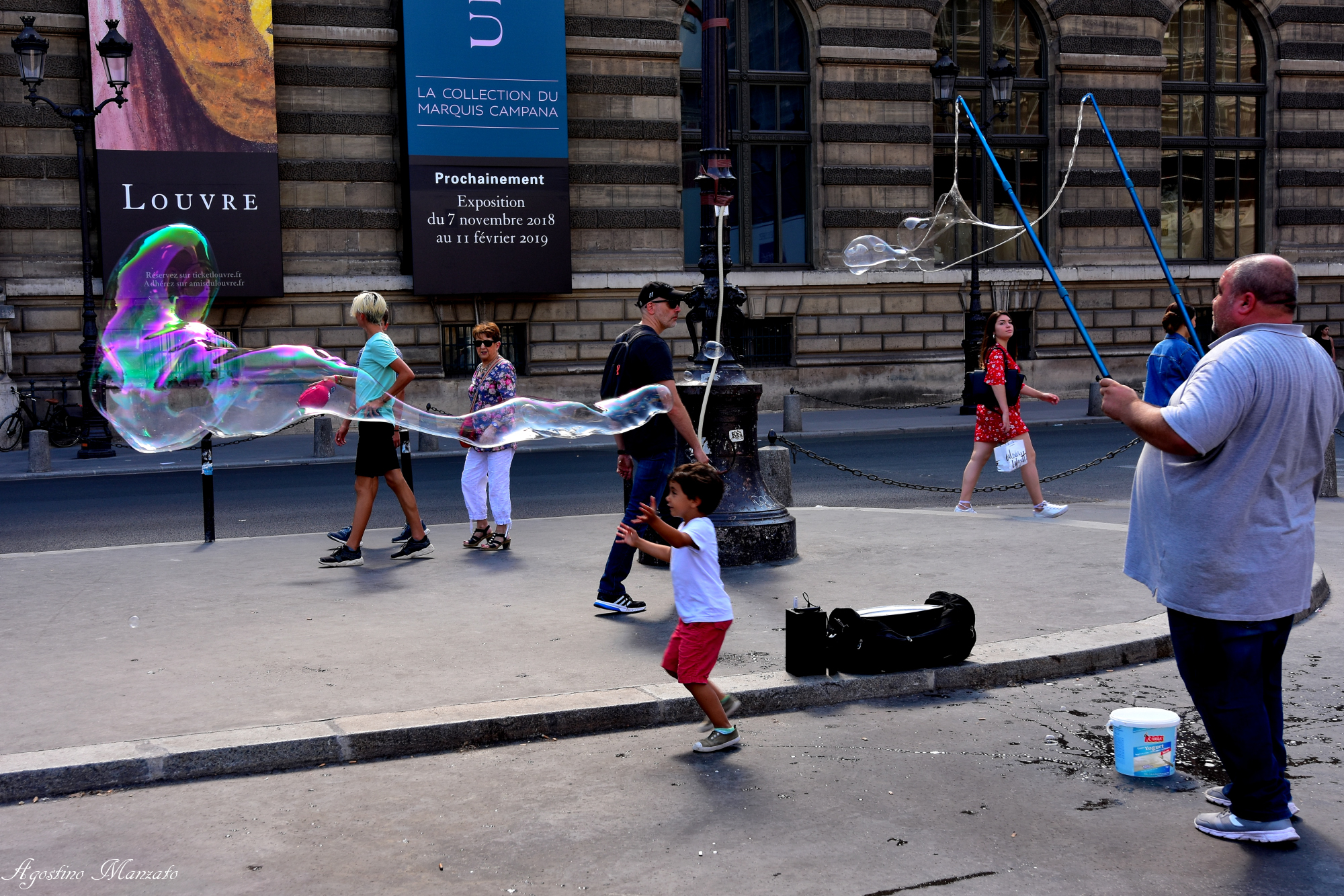 Playing in front of the Louvre...