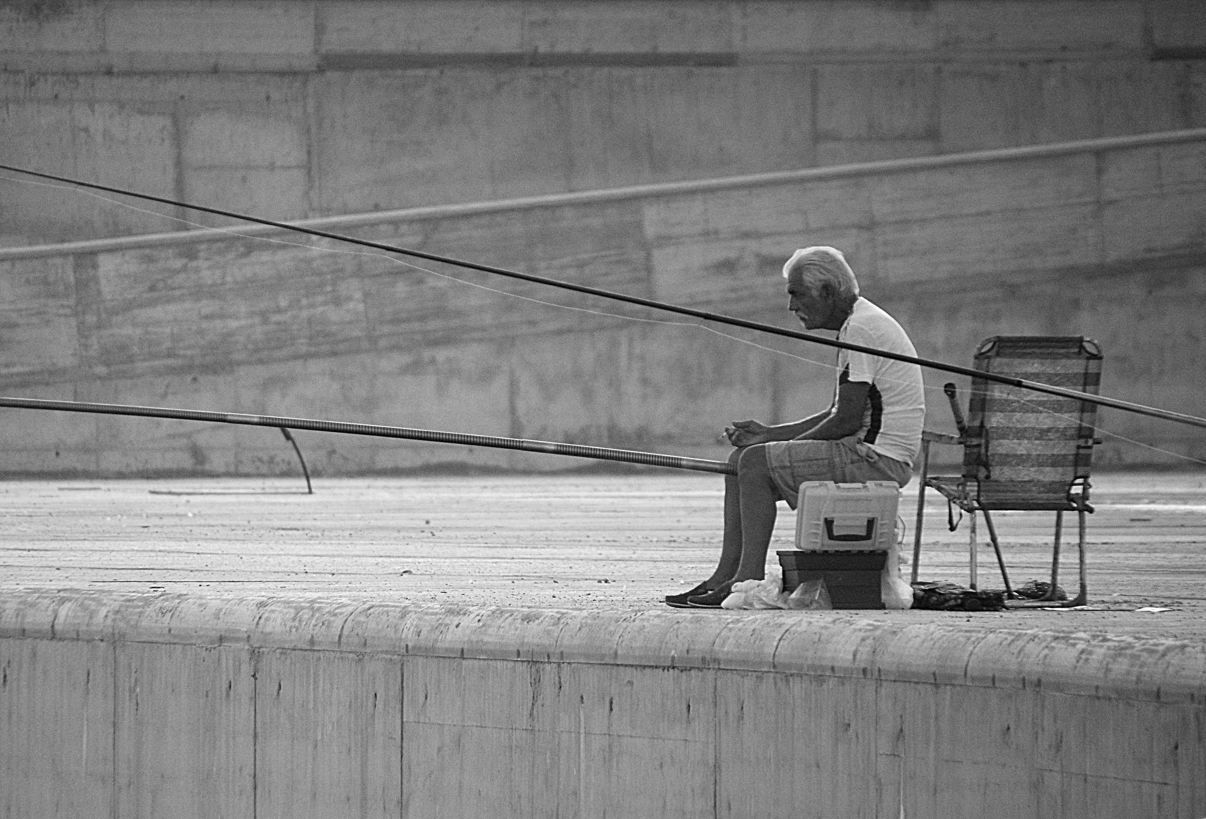 Fisherman with his back to the wall...