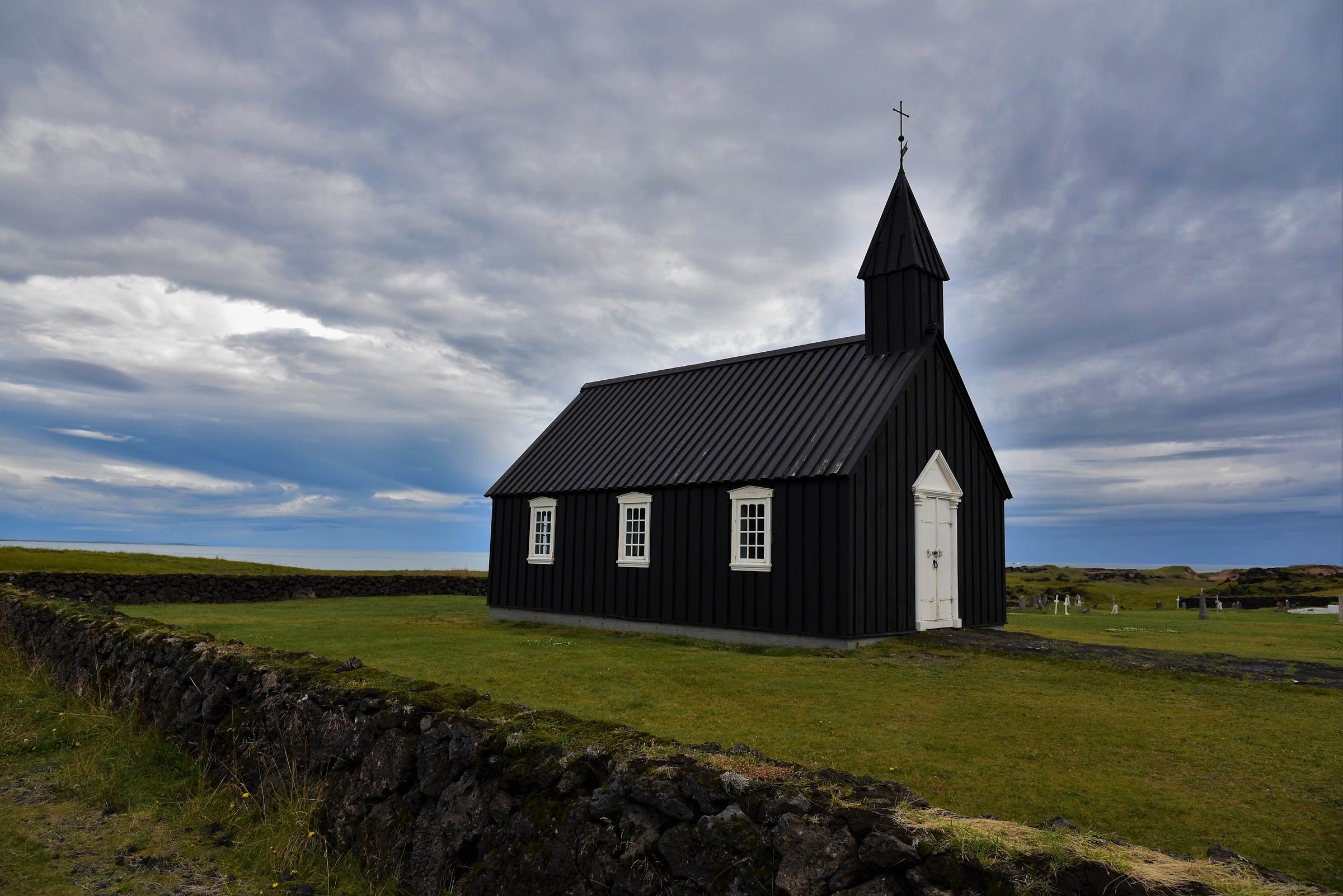 The old black church of Búðakirkja...