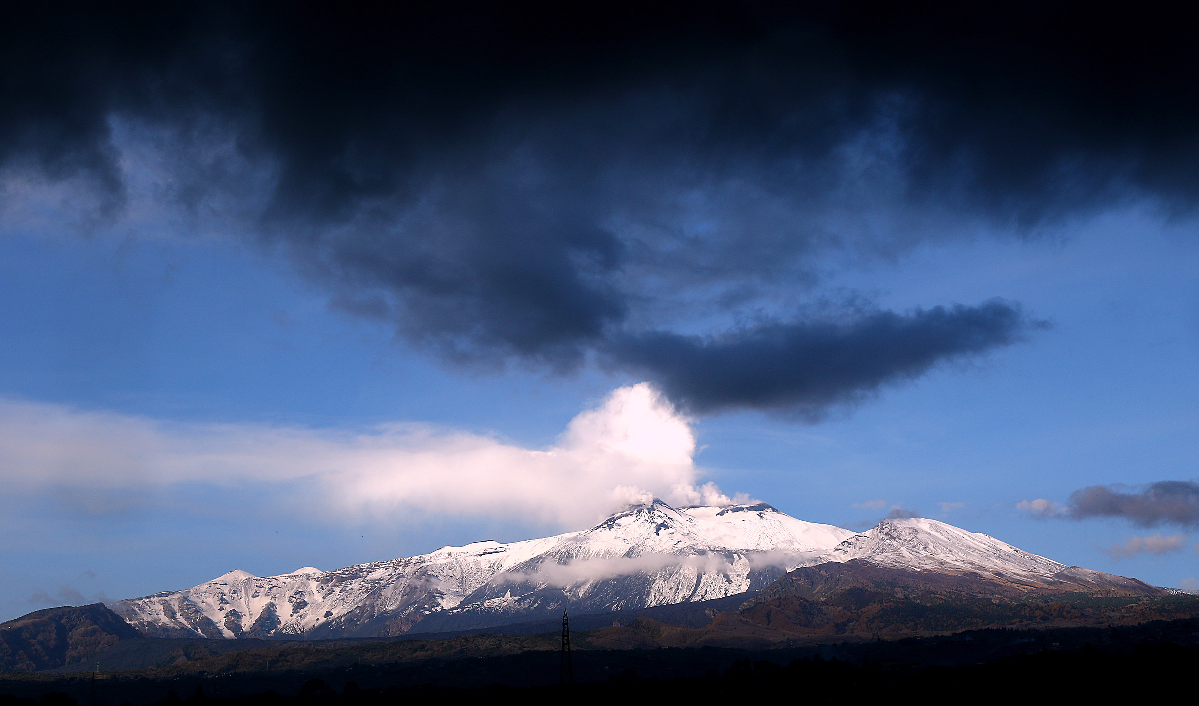 Stormy skies are gathering on Mount Etna....