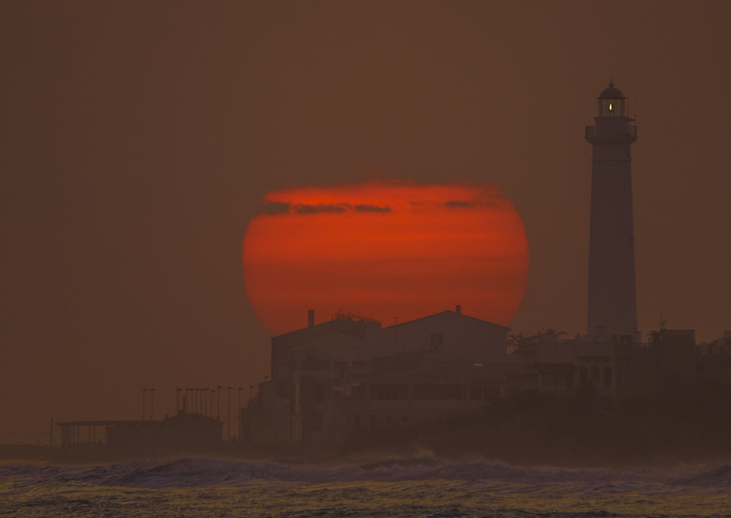 Sunset on the lighthouse of Punta Secca (Ragusa)...