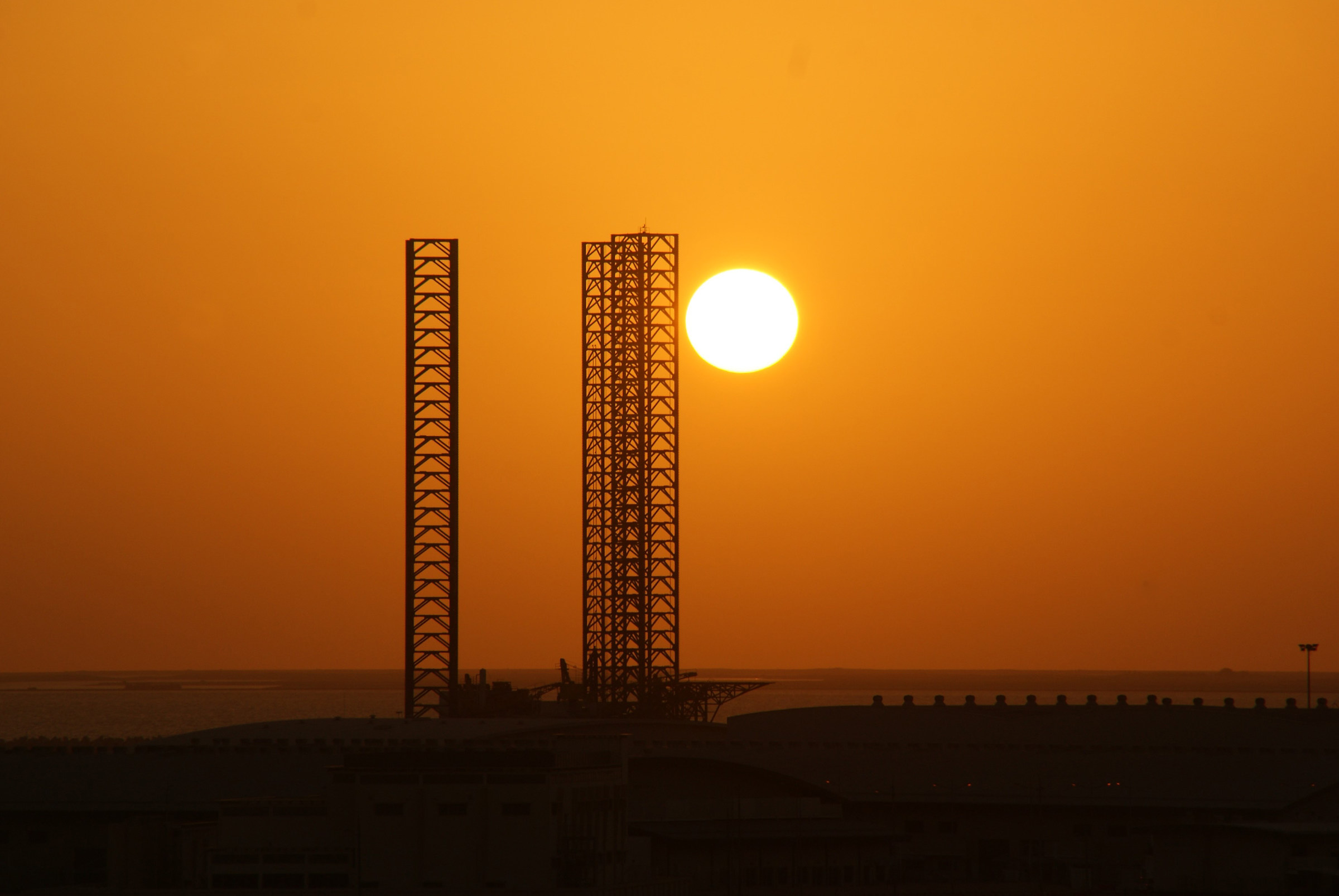 Oman, sunset on oil deposits...