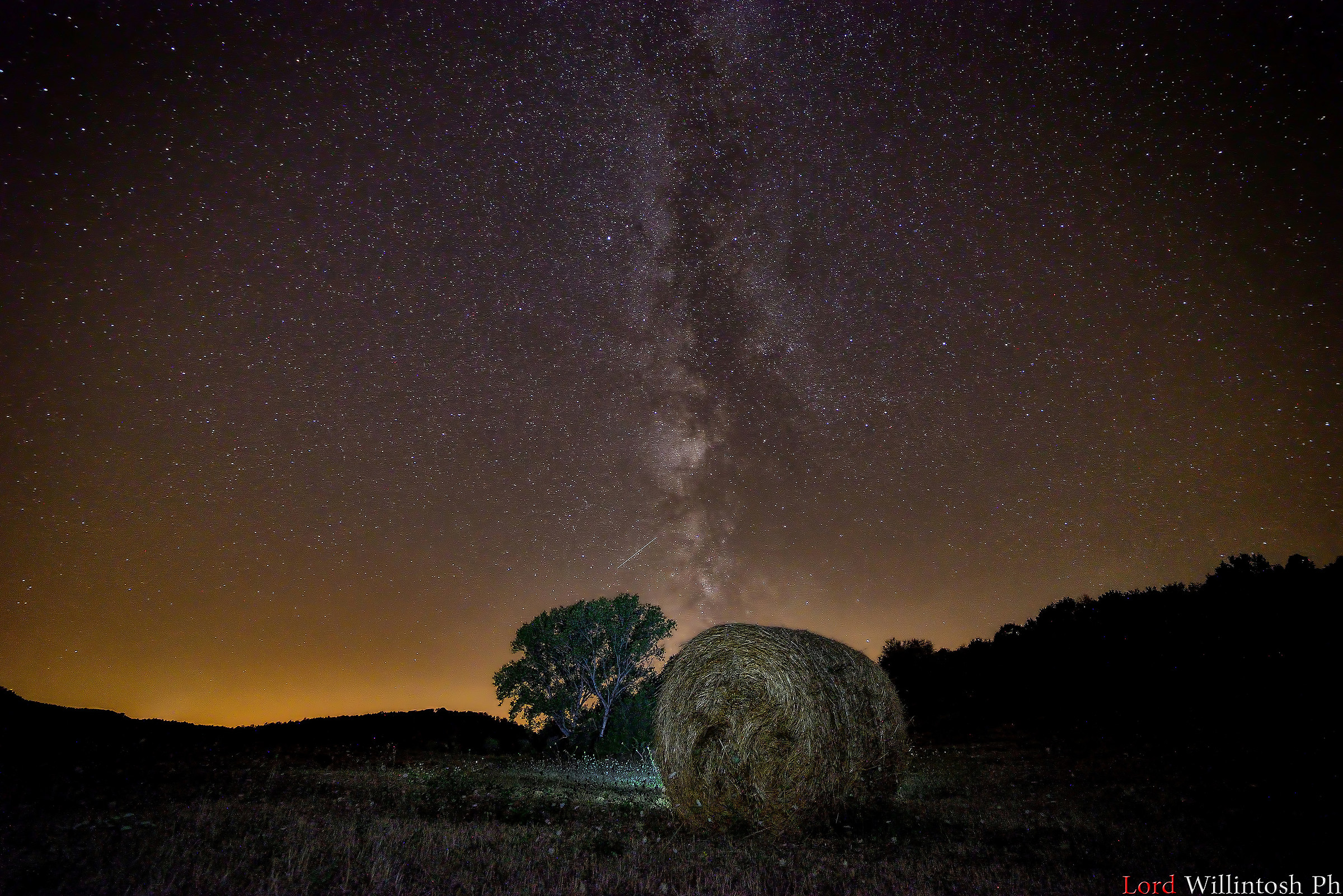 Milky Way behind the bale and the big tree...