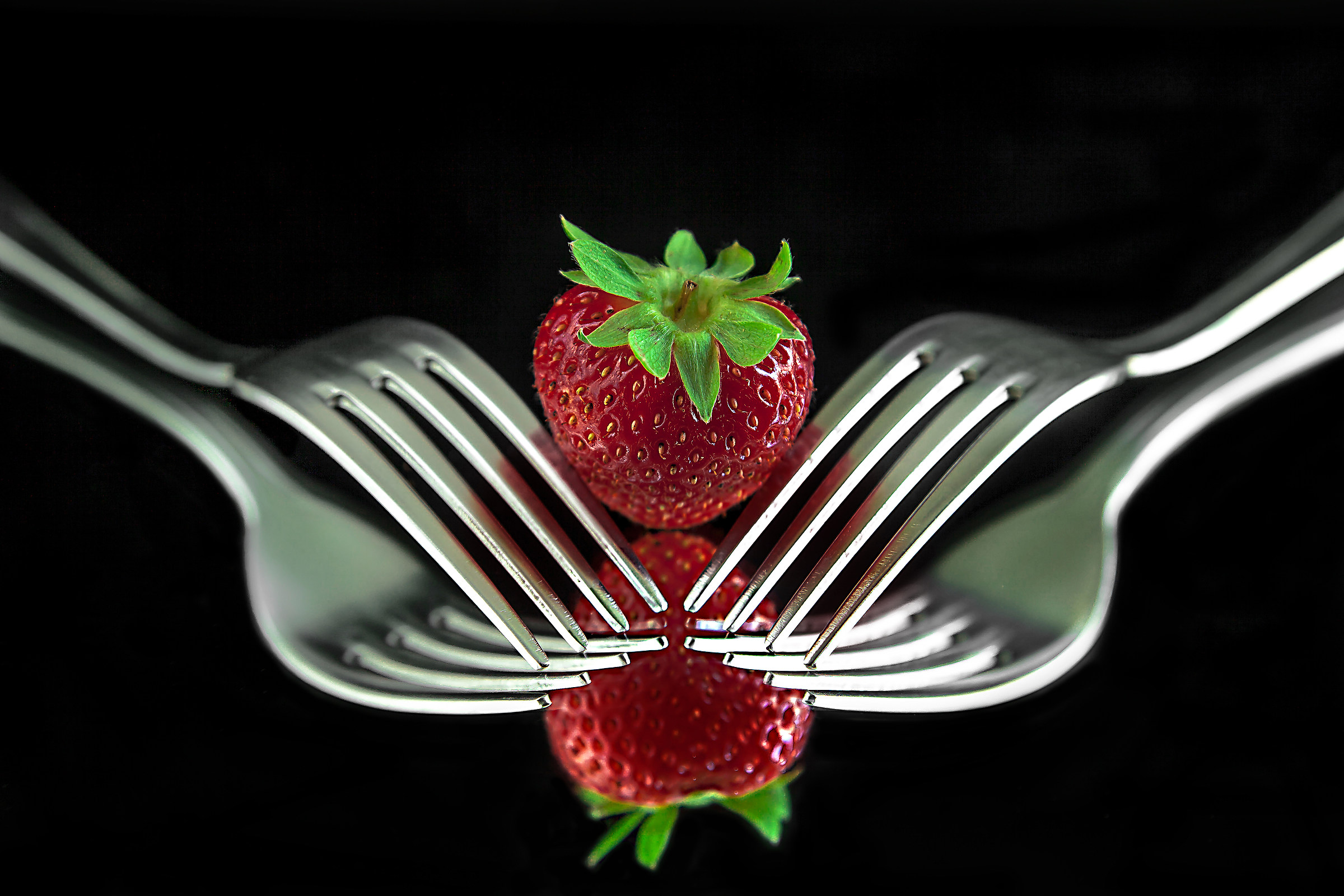 Strawberry and forks...