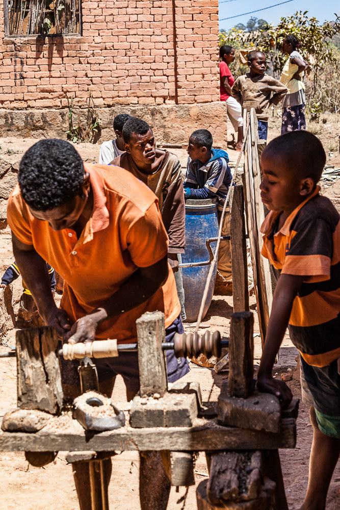 Madagascar, village: the human lathe!...