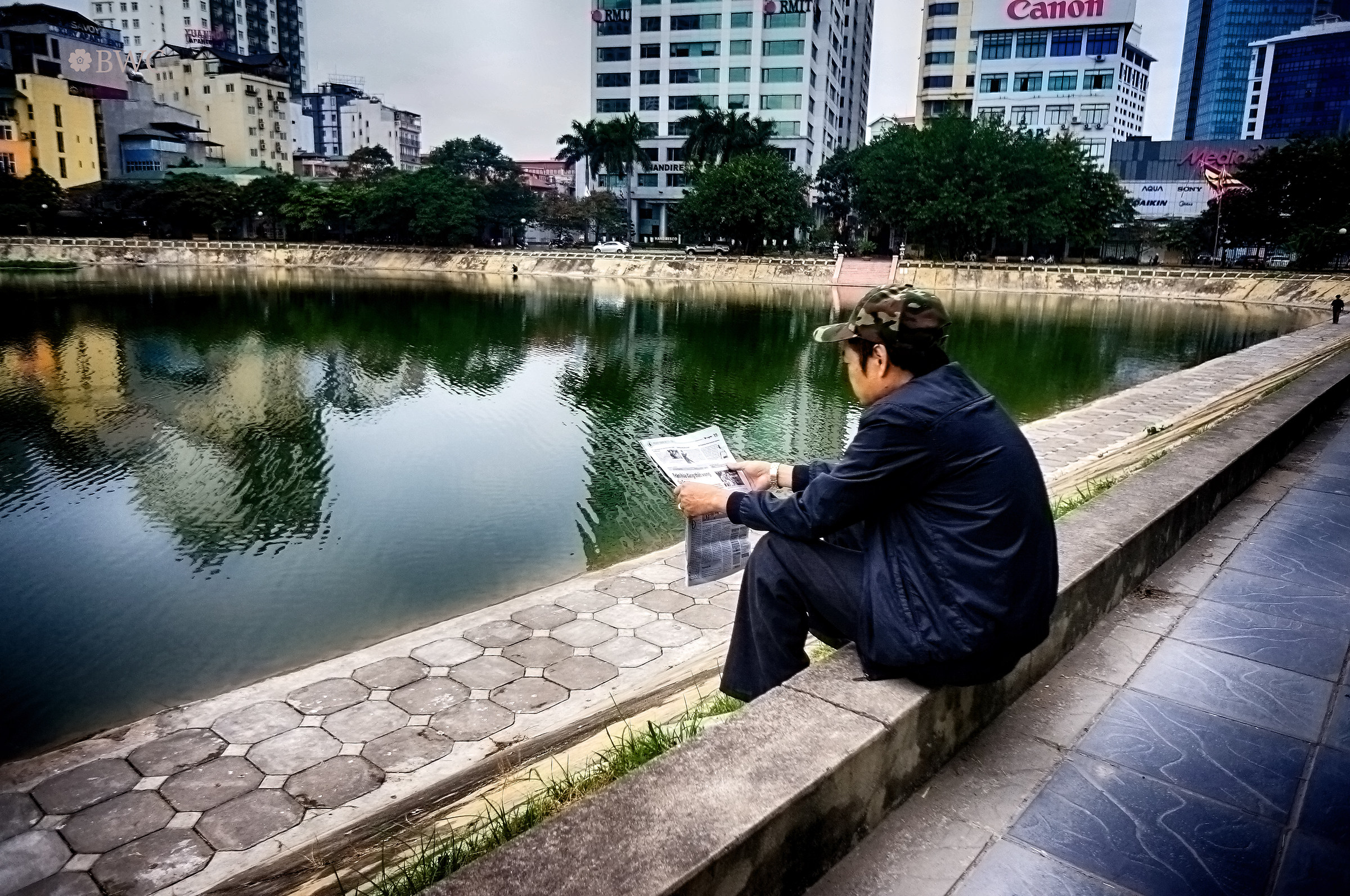 Bad Guy Reading News By The Lake...