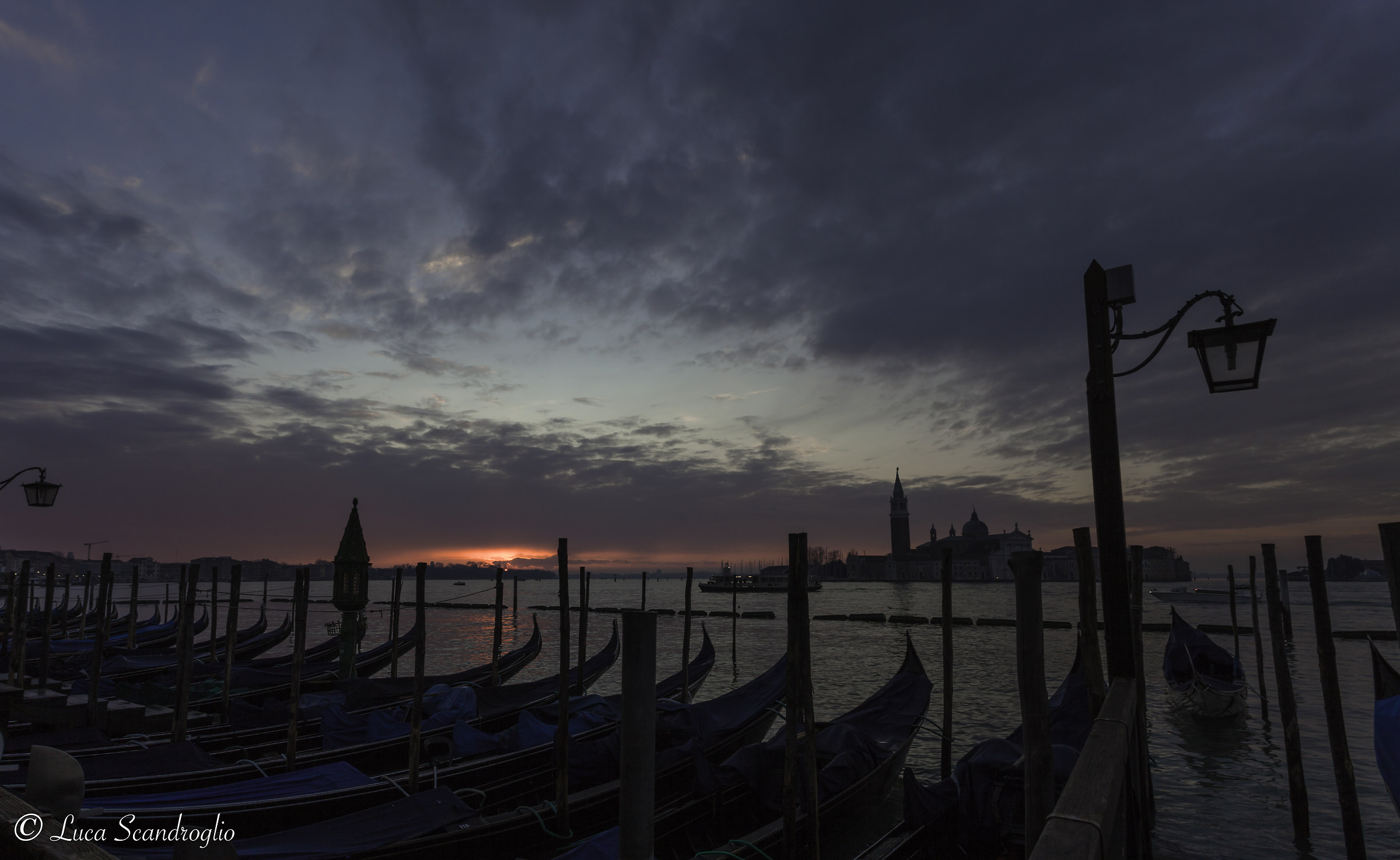 Gondolas and sunrise on Venice...