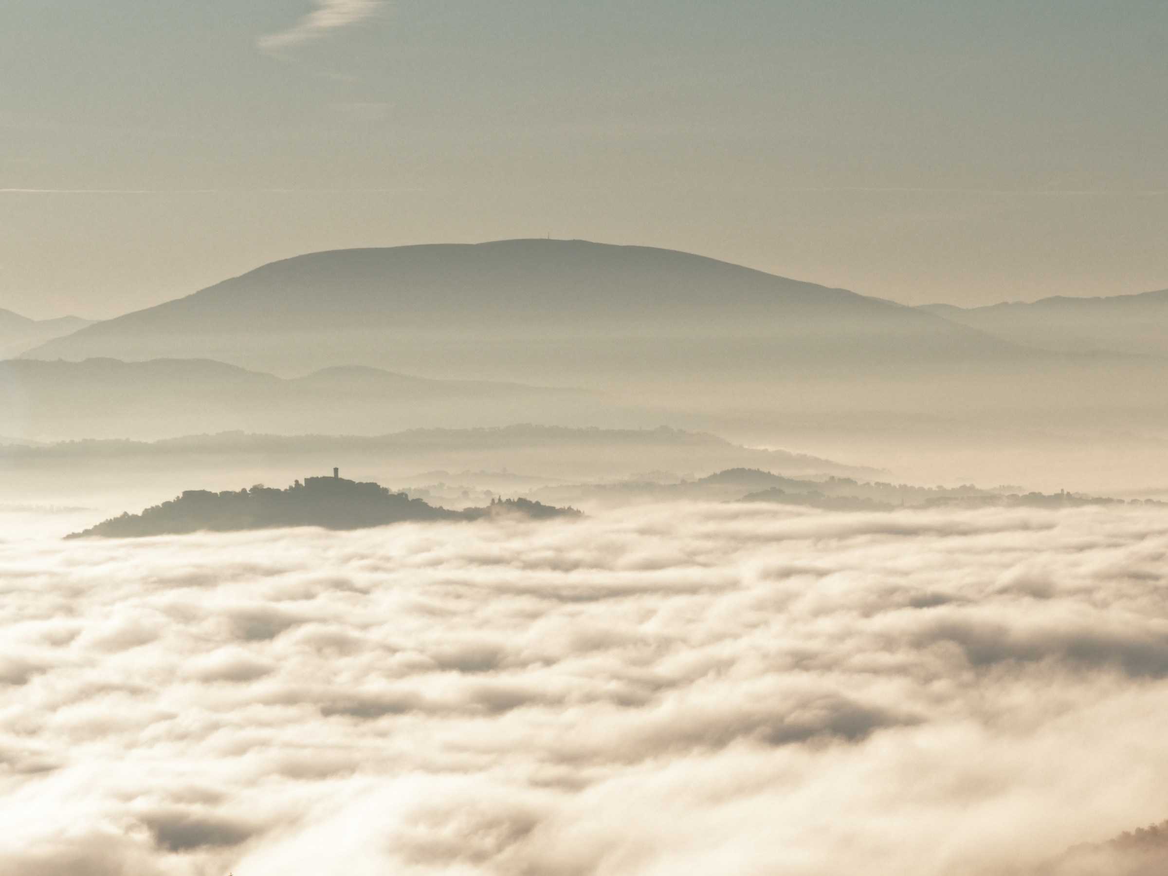 Island in the fog, seen from Monte Corona...