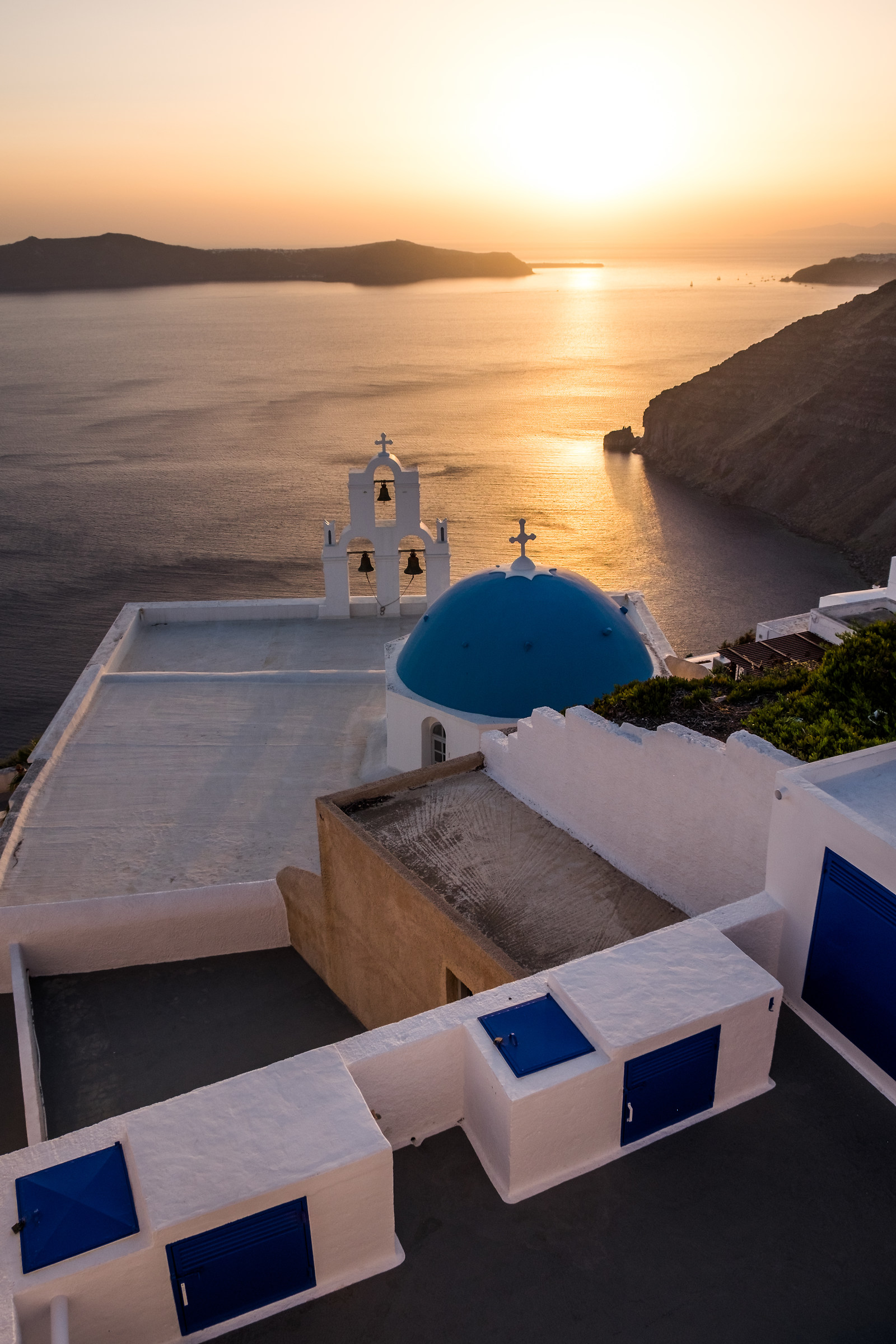 Sunset at the 3 bells of Fira...