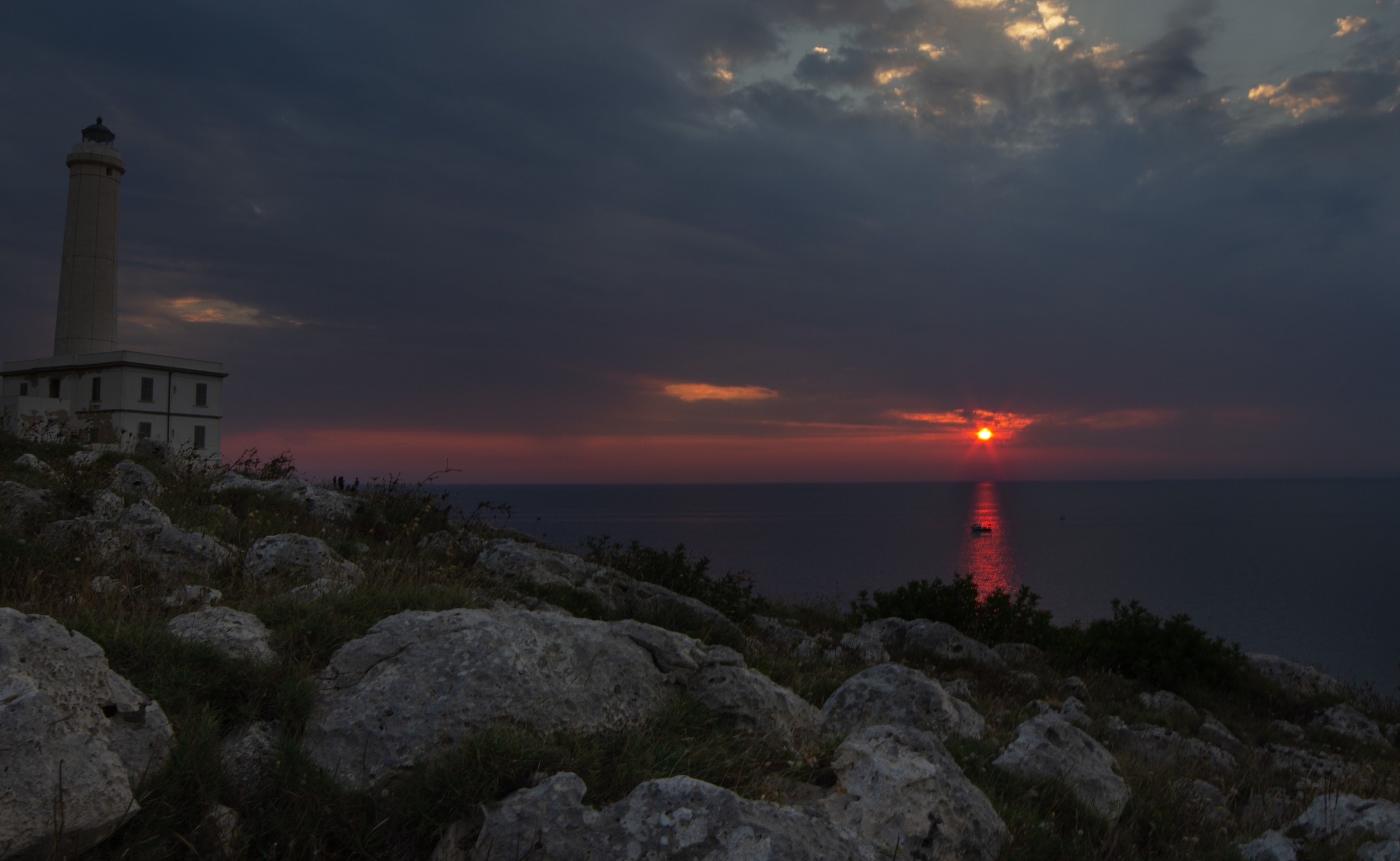 Sunrise at Punta Palascia with fishermen on the horizon...
