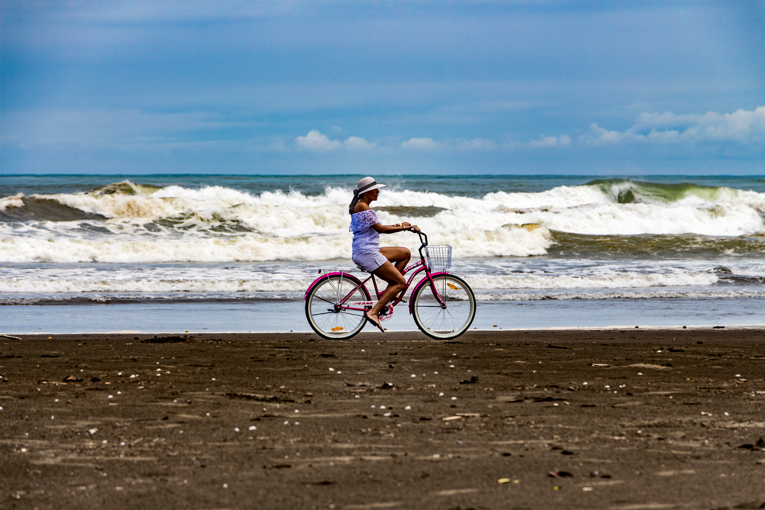 The ocean, the girl and the purple bike...