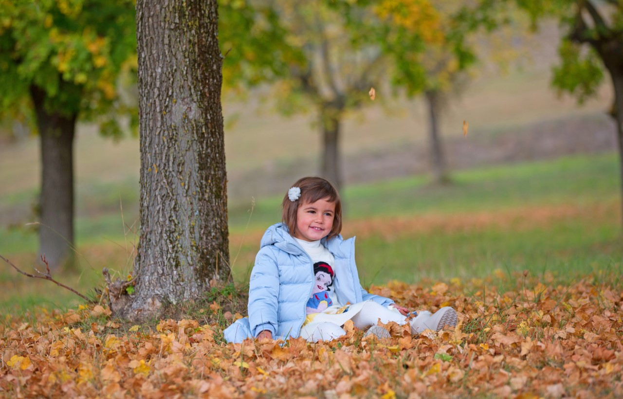 greta - granddaughter in the foliage...