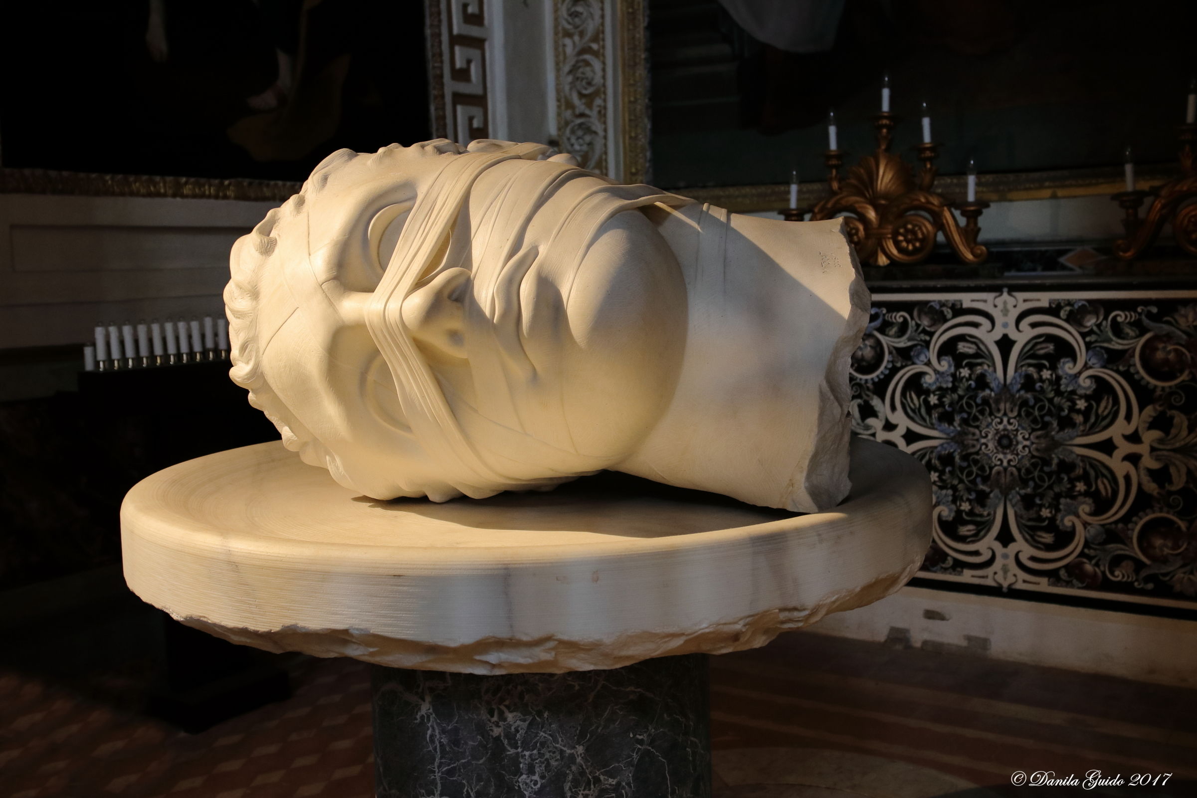 Head of John the Baptist (sculptor Igor Mitoraj)...